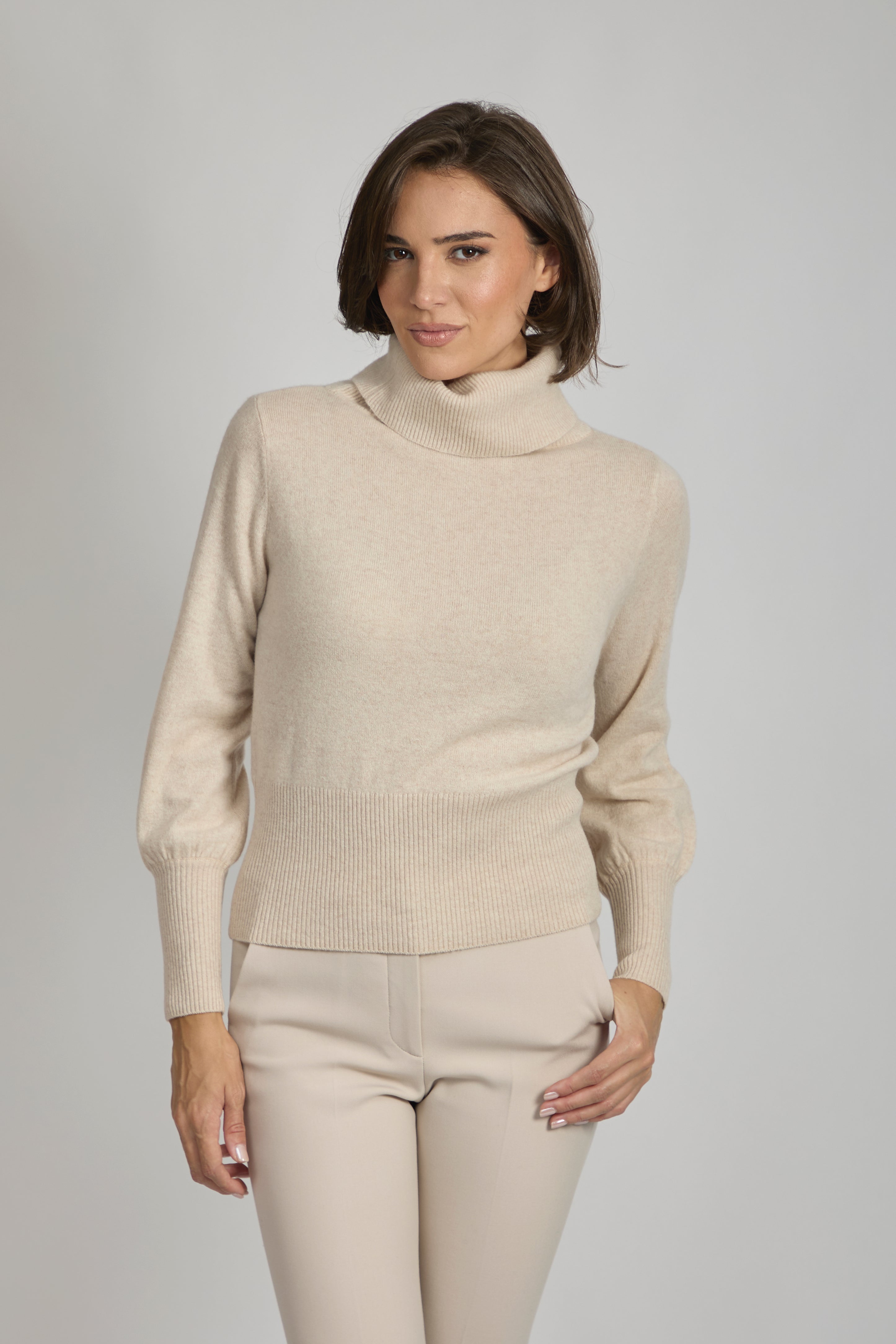 Cashmere roll-neck sweater with balloon sleeves and a clean knit body.