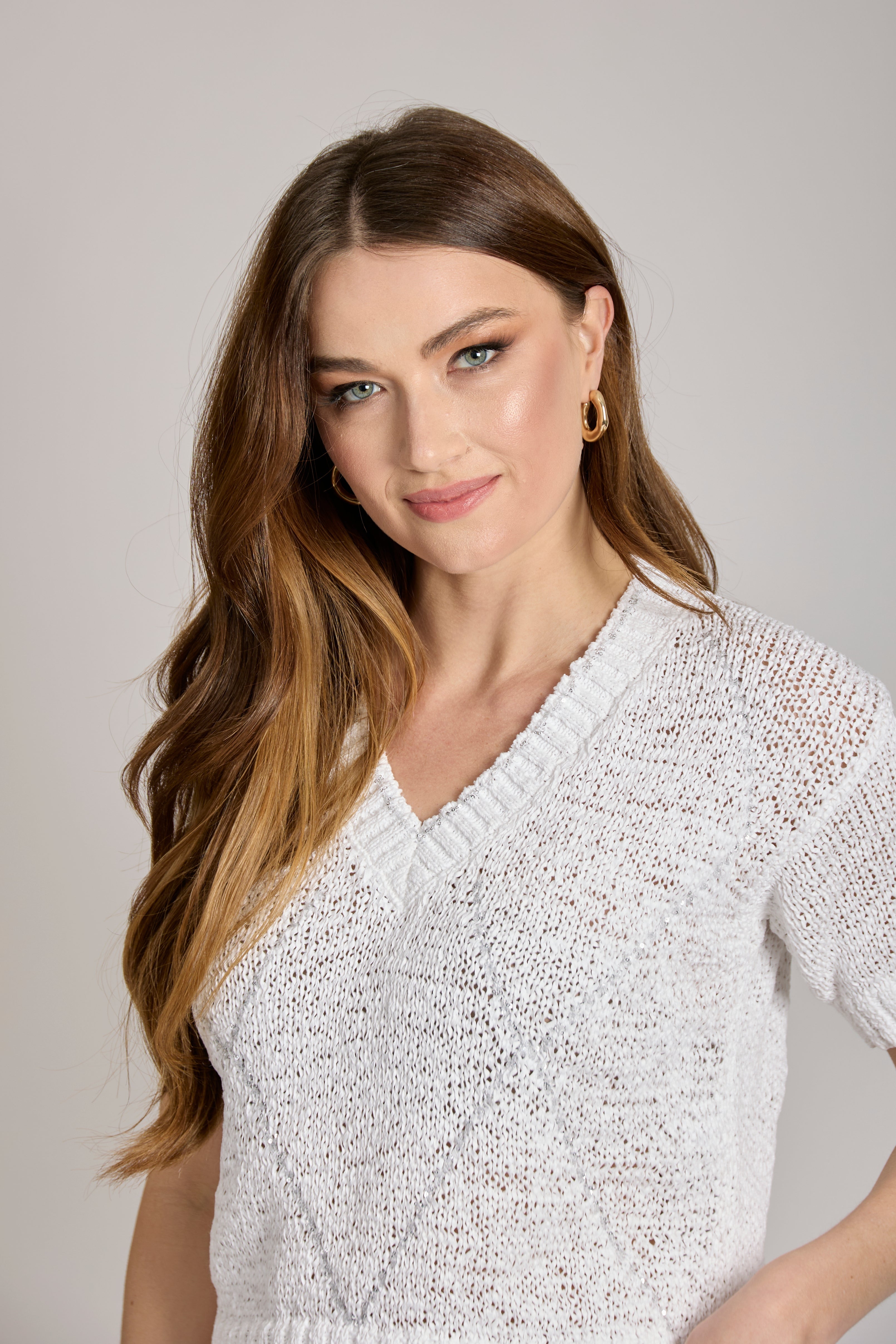 White cashmere short-sleeve knit top in a clean minimal silhouette