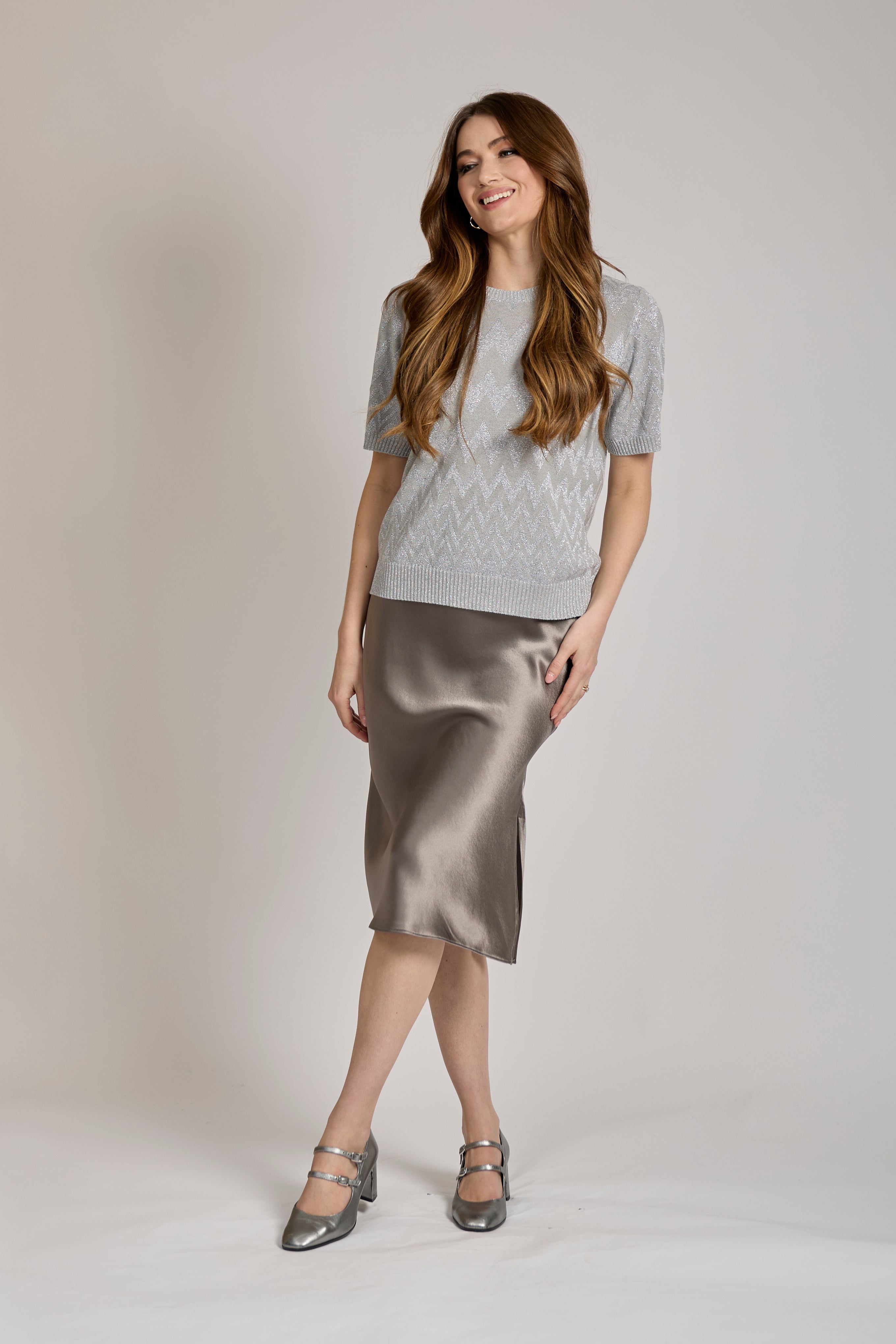 Cashmere knit short-sleeve top with crew neckline and fine-gauge knit, classic silhouette.