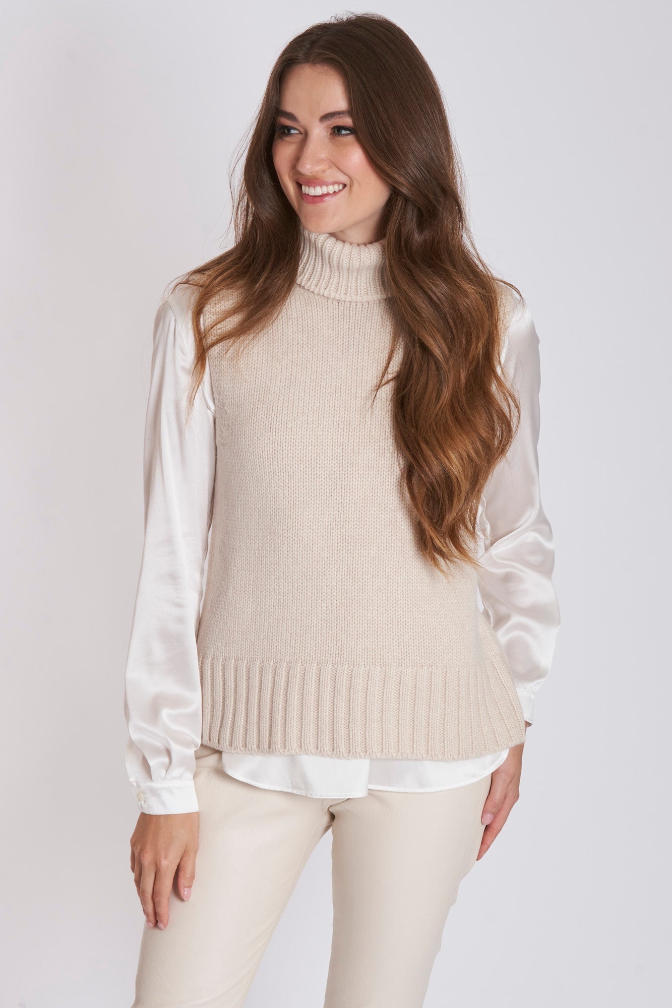 Divine Cashmere sleeveless high-neck cashmere sweater with ribbed trim and relaxed silhouette
