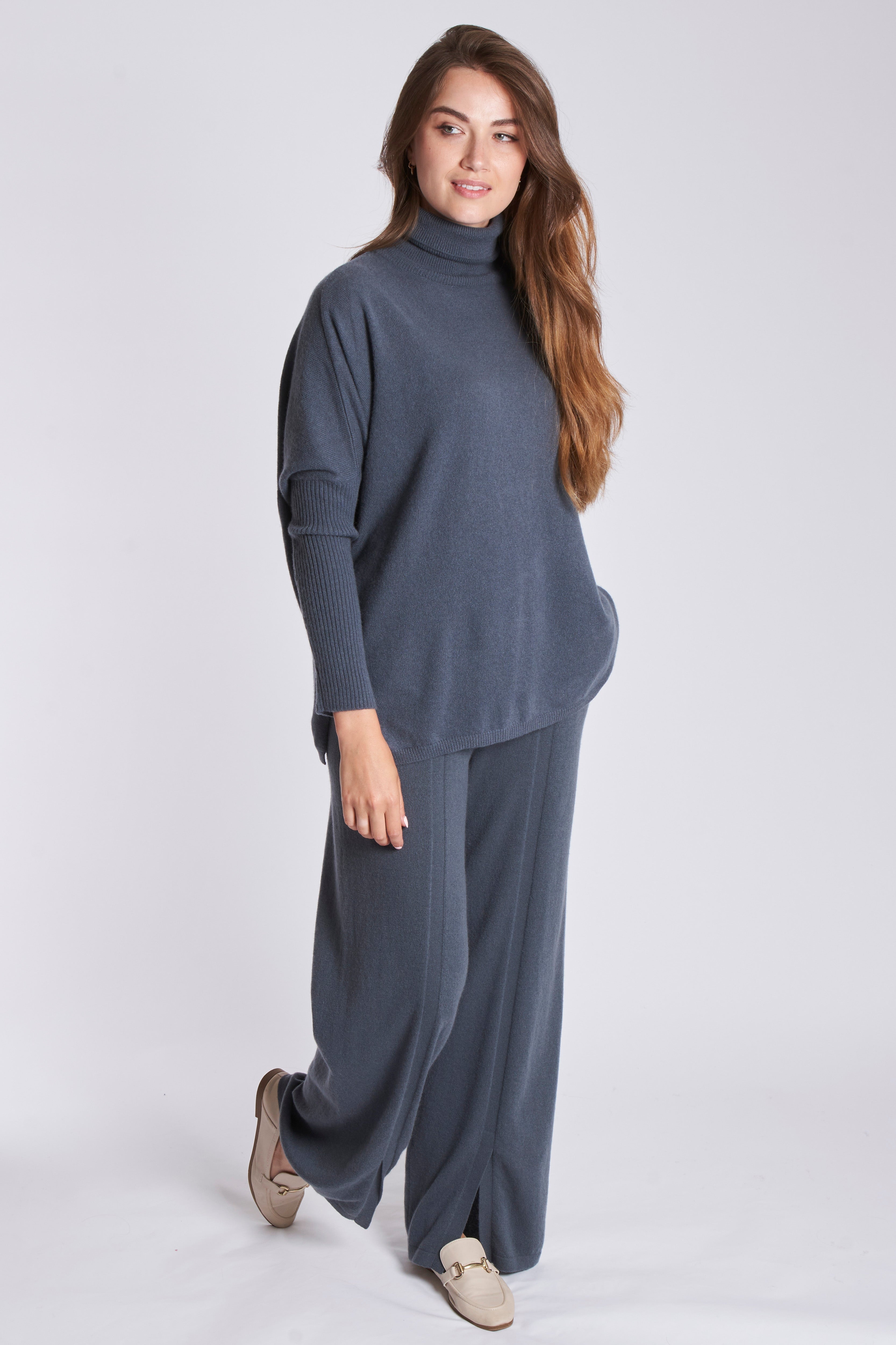 Divine Cashmere tailored cashmere trousers with a straight silhouette and clean tailoring details.