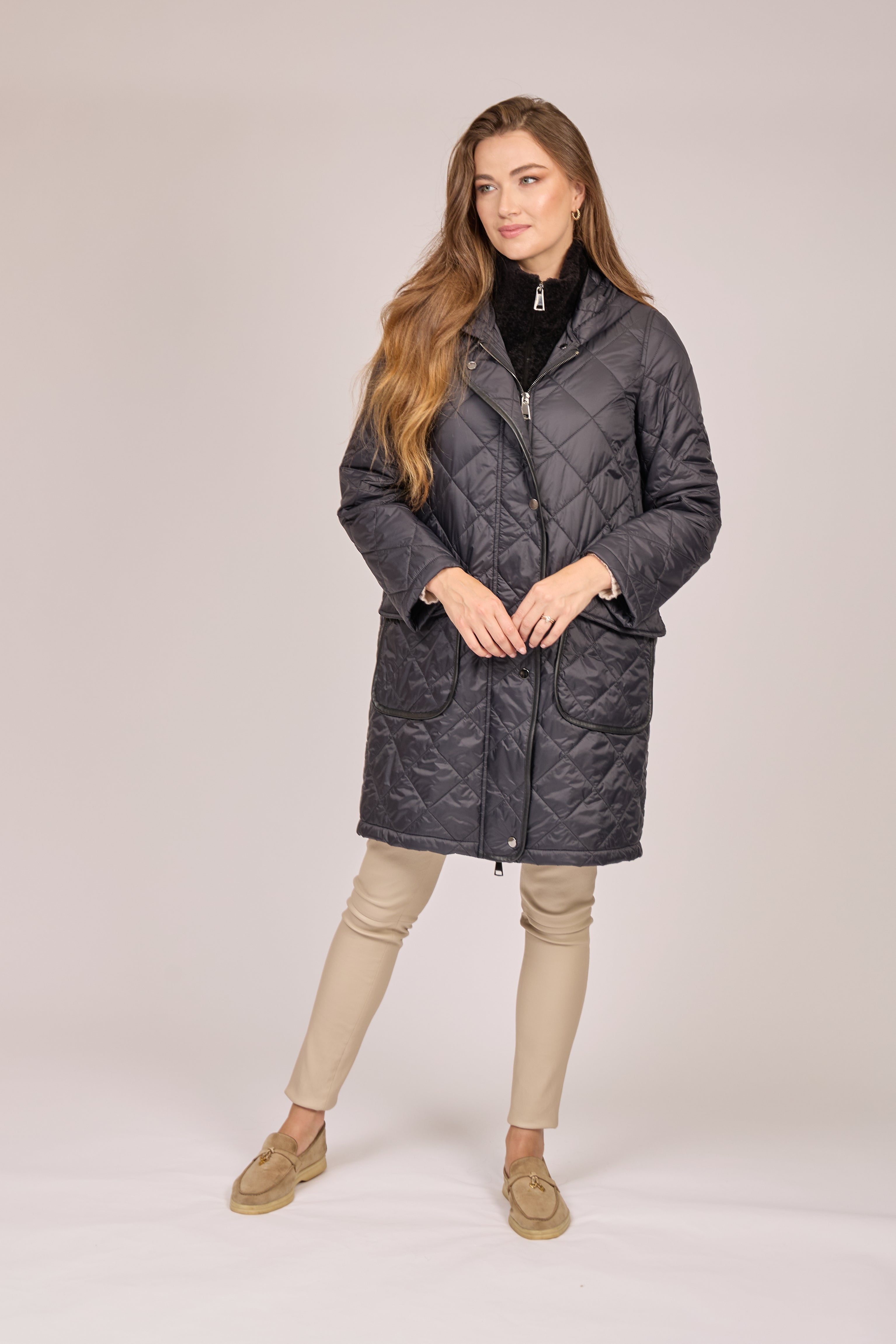 Divine Cashmere hooded quilted coat in black with horizontal quilting, zip front, side pockets, mid-thigh length
