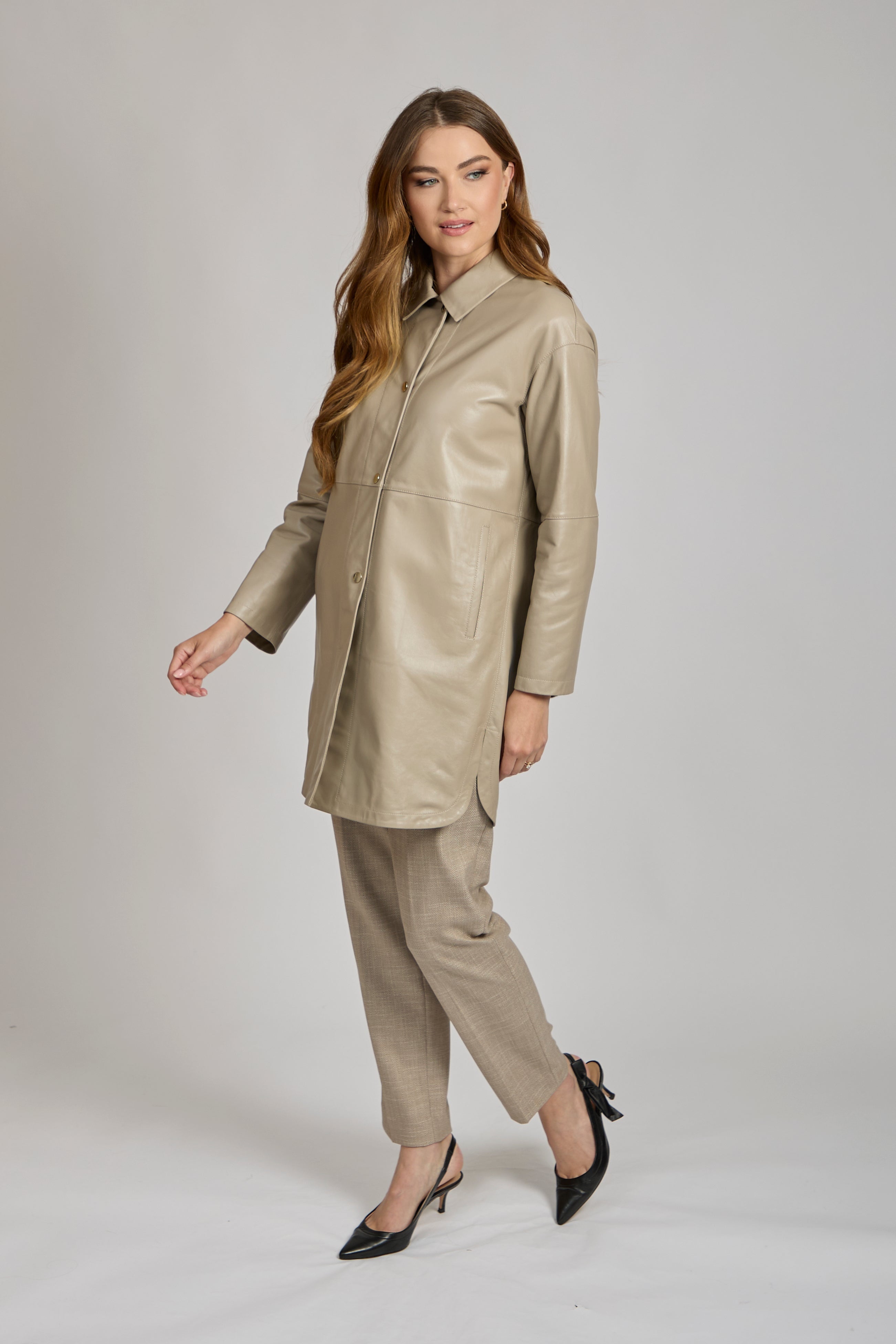 Long leather coat with collar and full-length silhouette