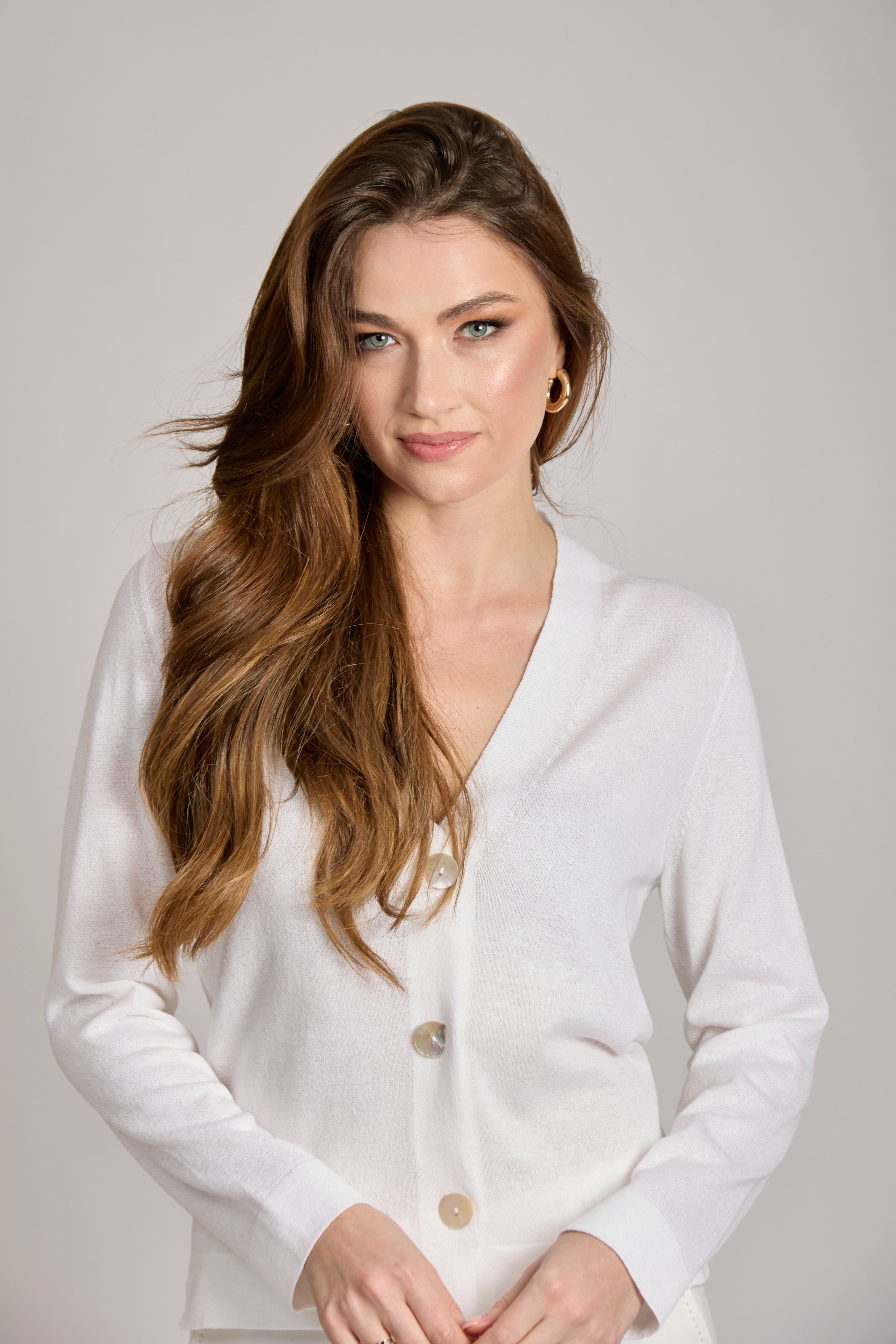 Soft cotton knit cardigan with relaxed silhouette, long sleeves and ribbed trim.