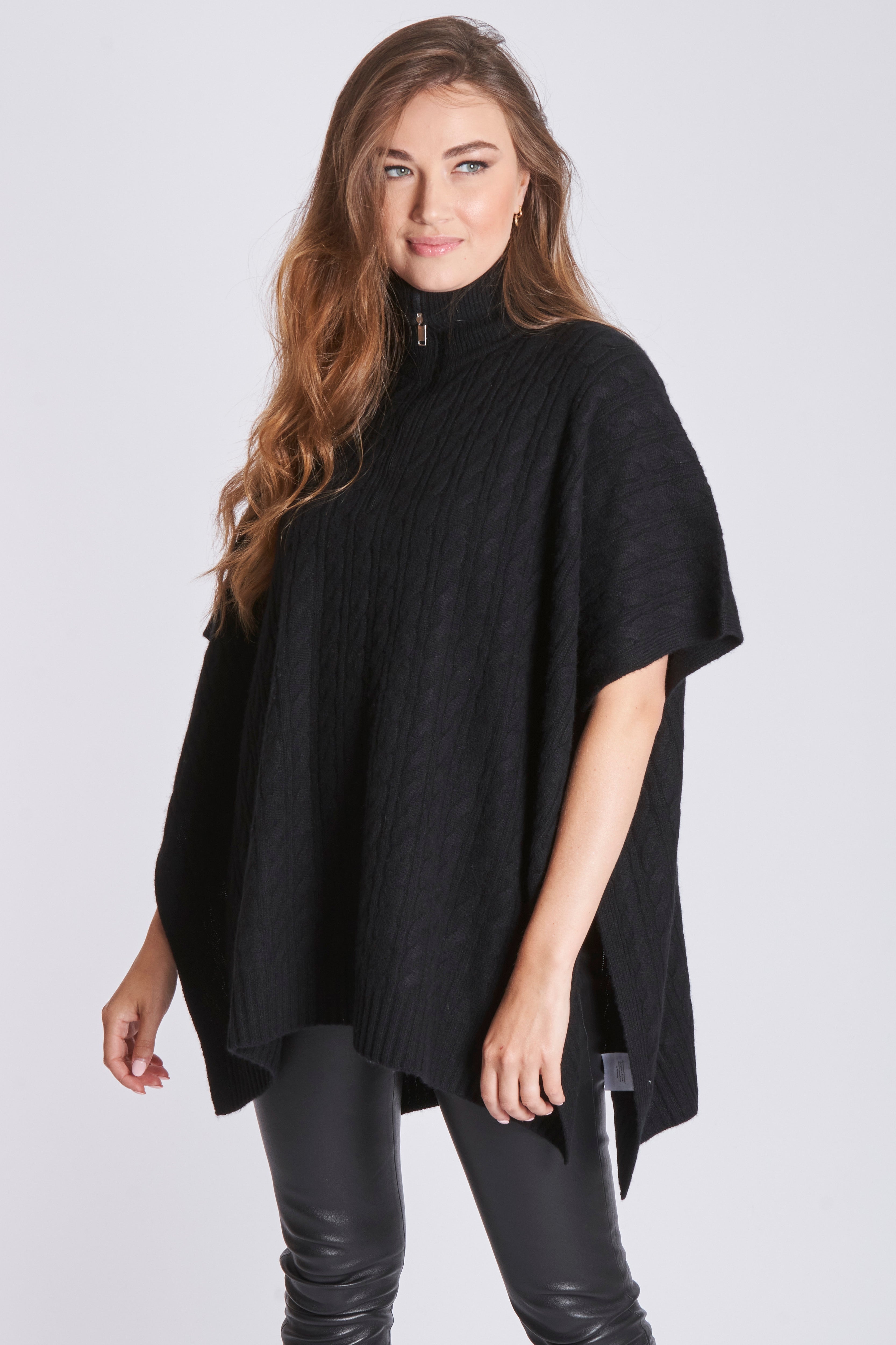 Cashmere cable-knit cape with draped silhouette and braided cable stitch texture