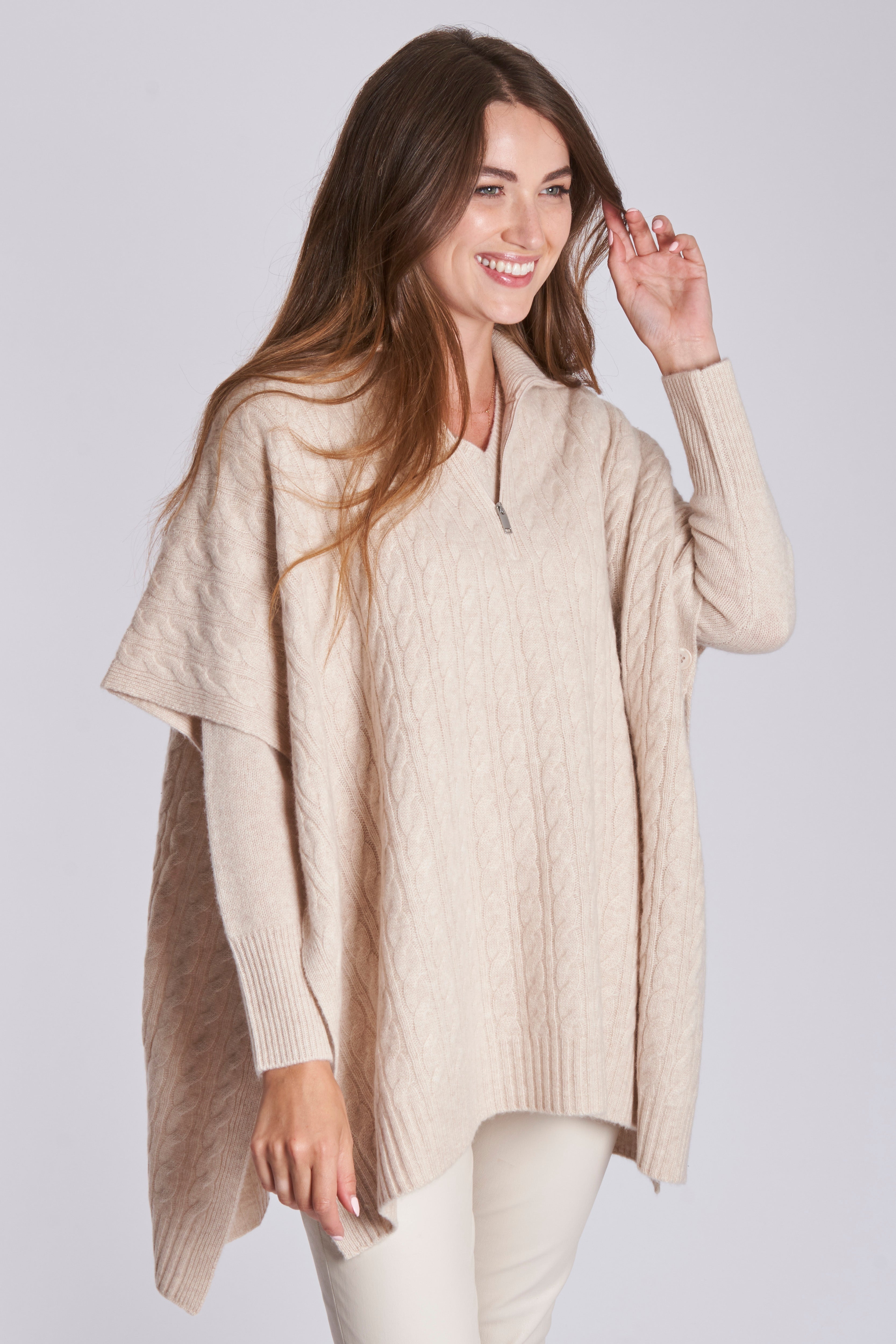 Cashmere cable-knit cape with textured cables and draped open-front silhouette