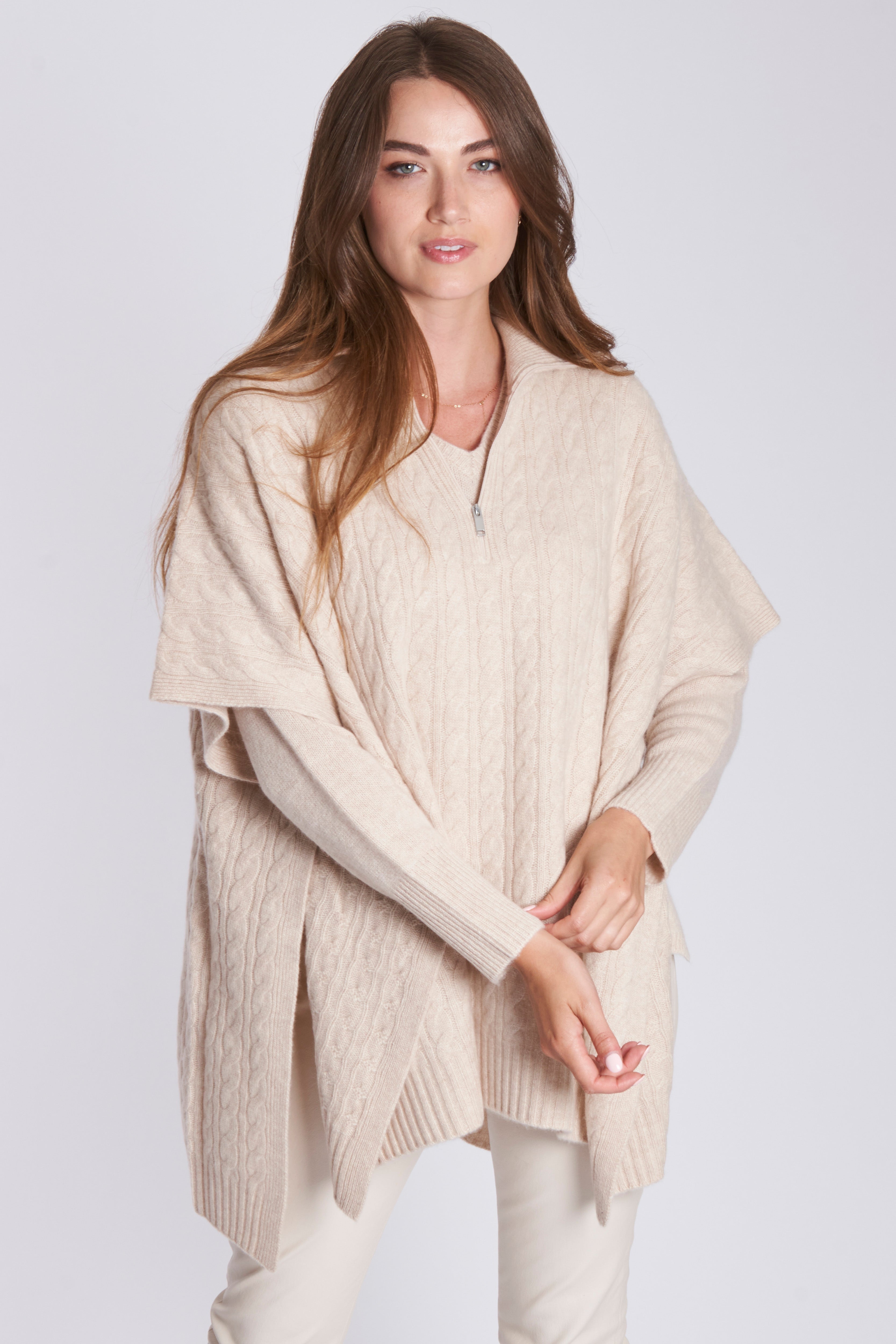 Cashmere cable-knit cape with textured cable pattern and relaxed drape