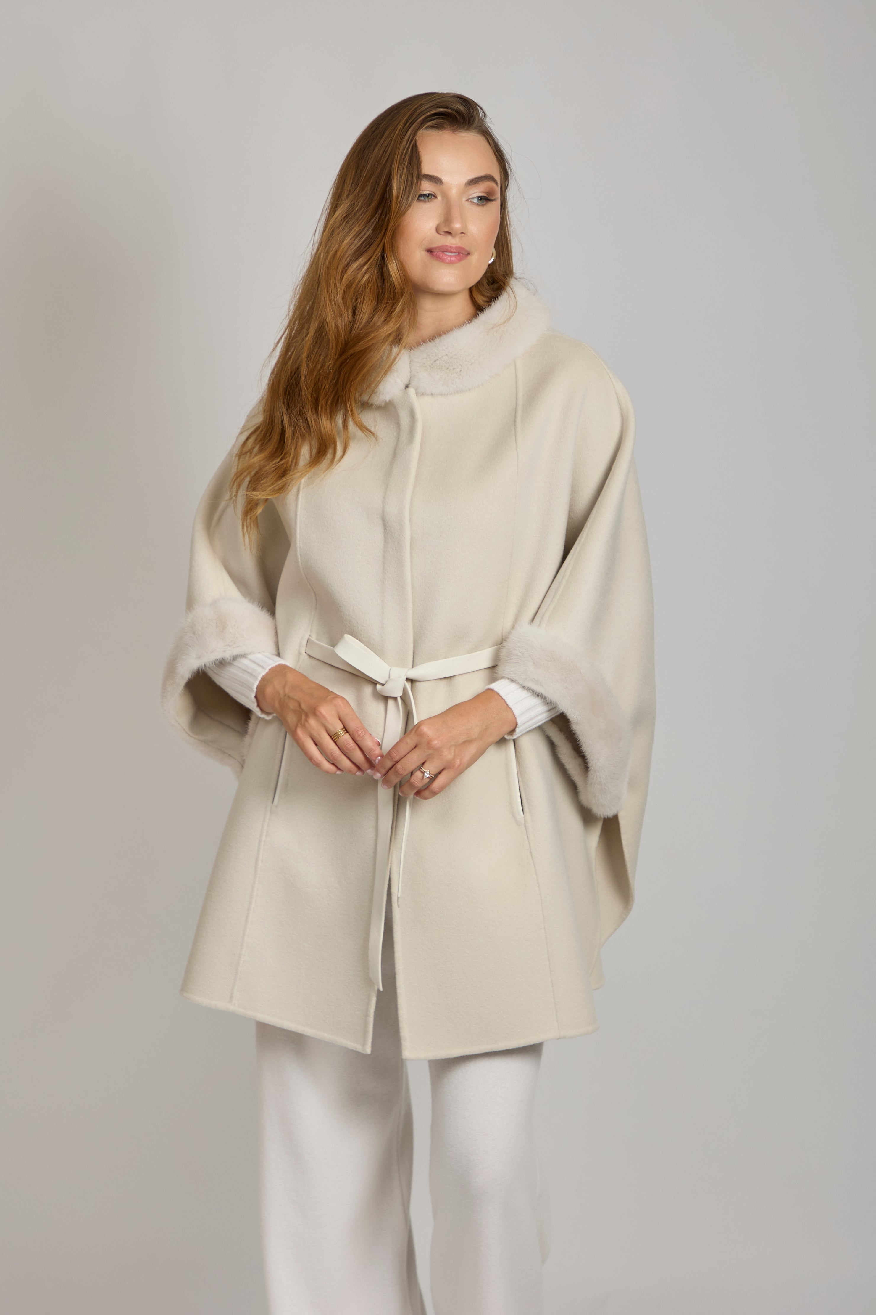 Cashmere cape with mink trim along the edges, draped silhouette