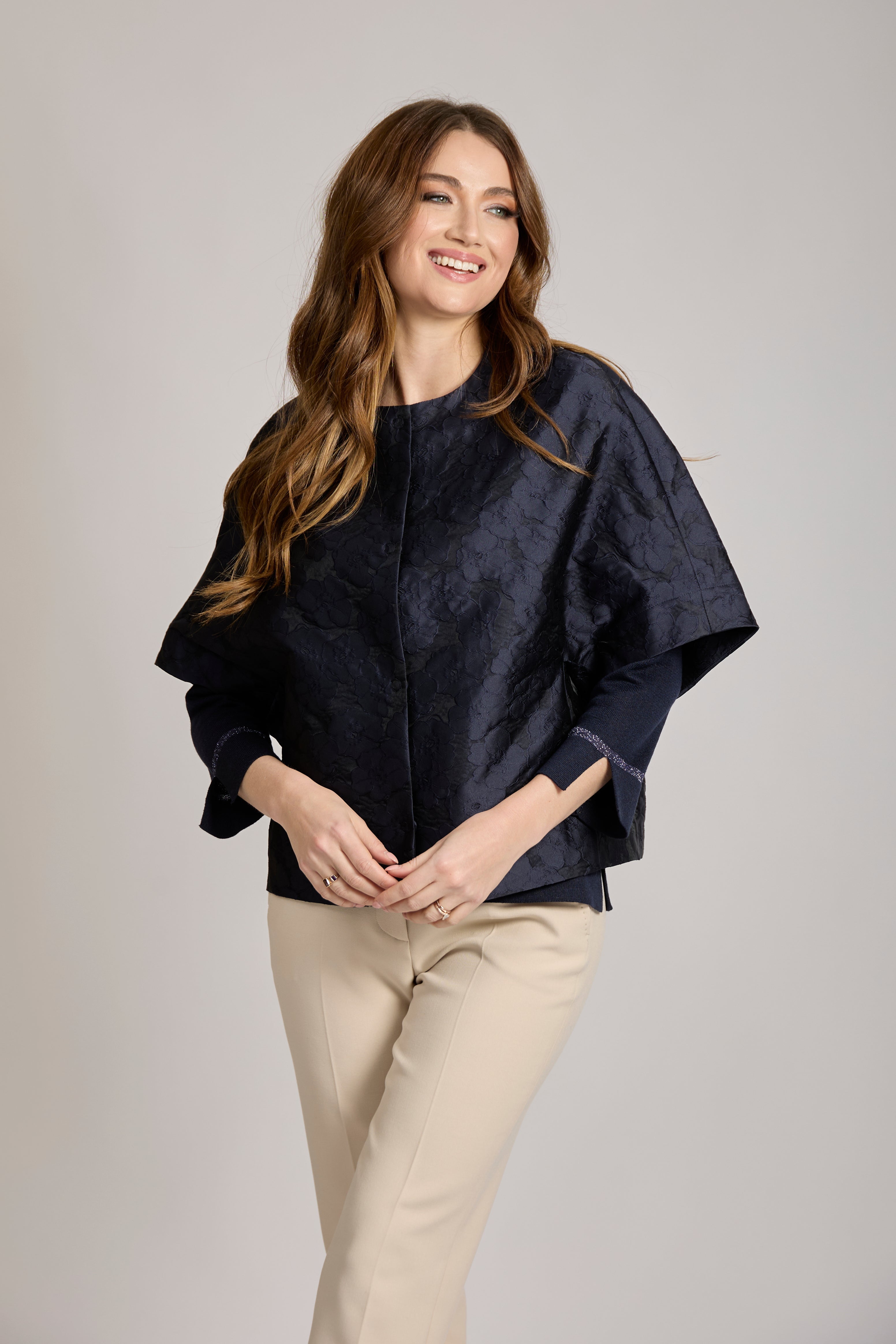 Blue cashmere jacquard short jacket with cropped boxy cut, tonal jacquard pattern and front buttons.