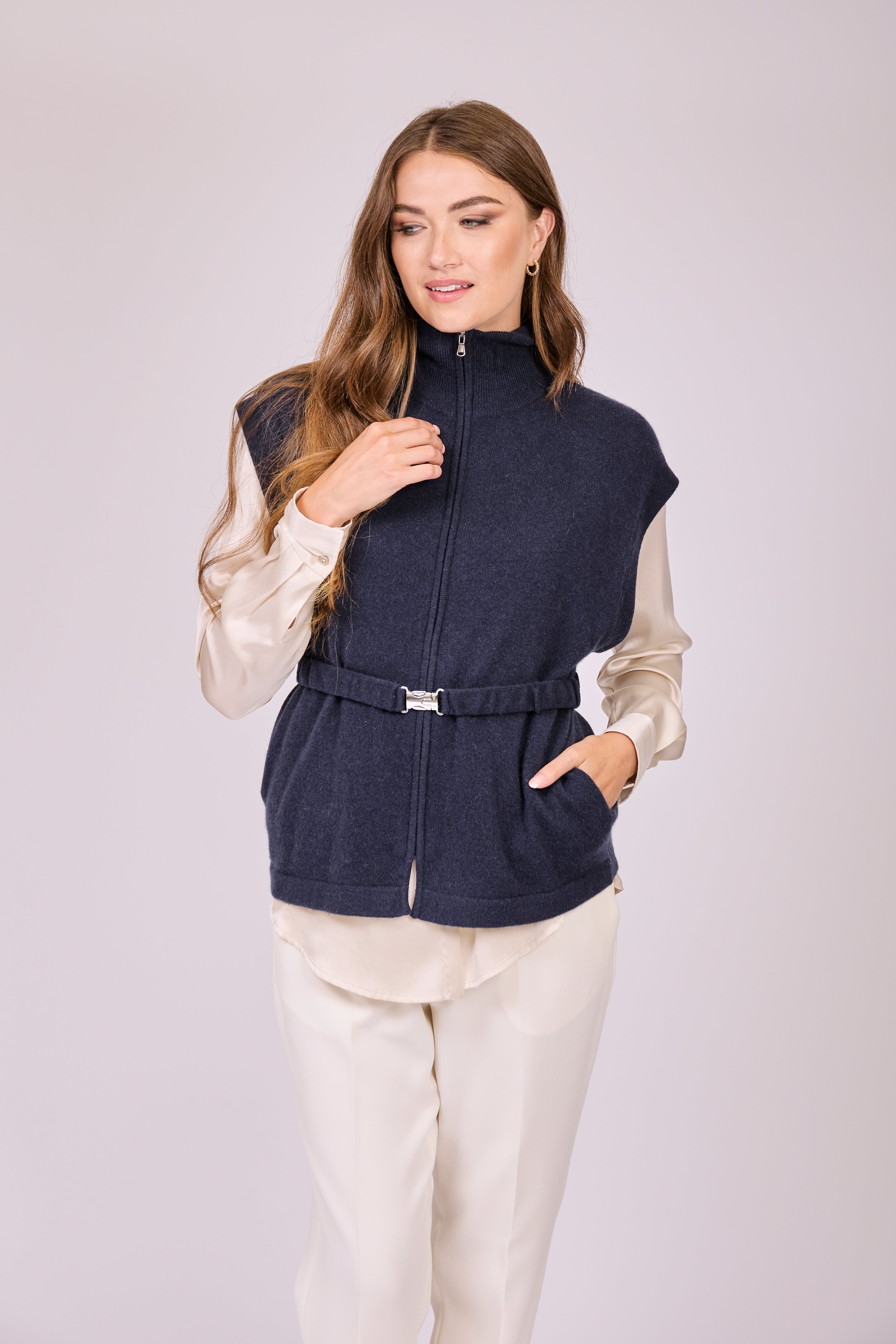 Navy cashmere zip vest with high collar and front zipper, sleeveless fitted knit.