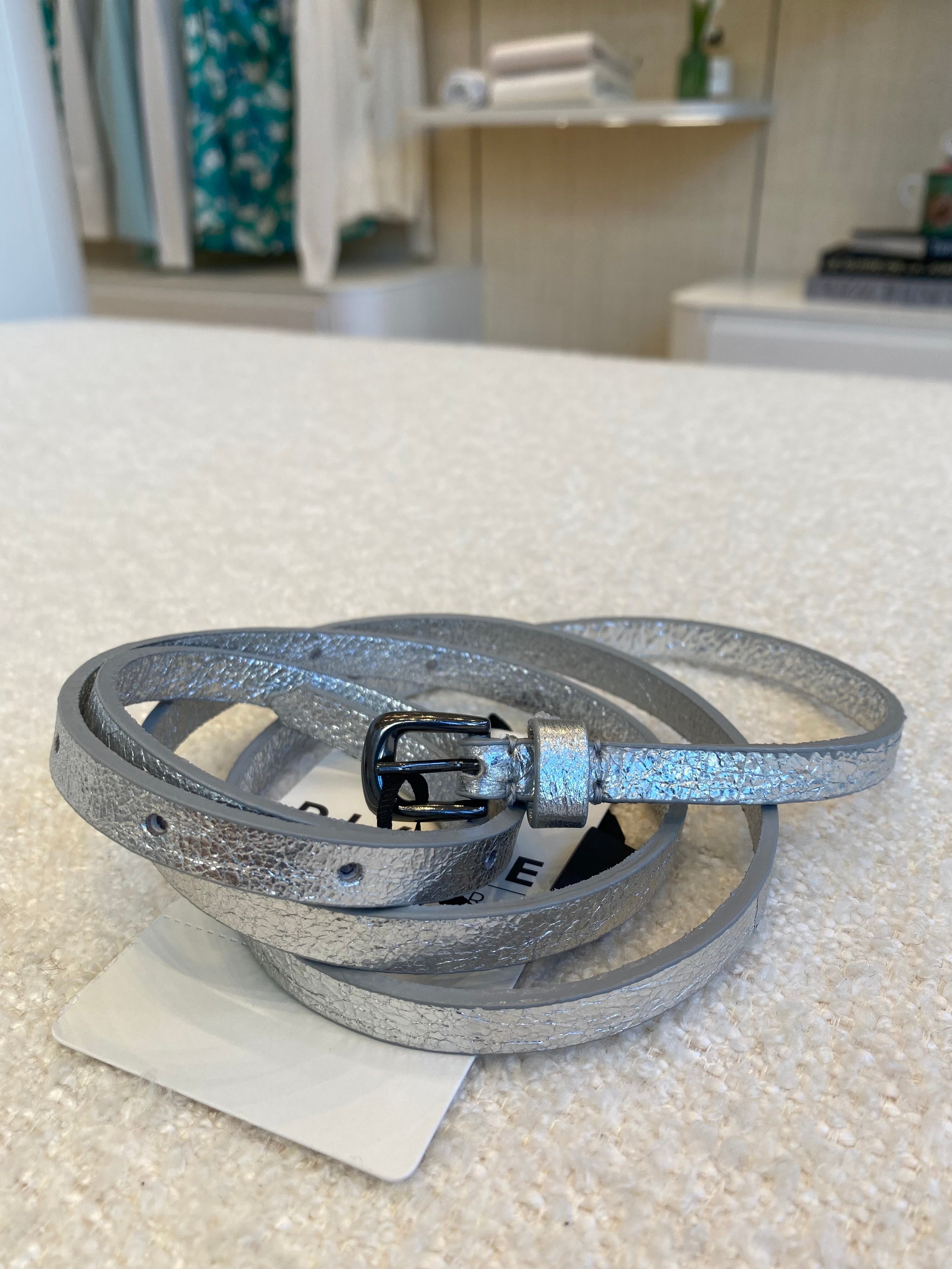 Leather belt with silver buckle and classic strap design